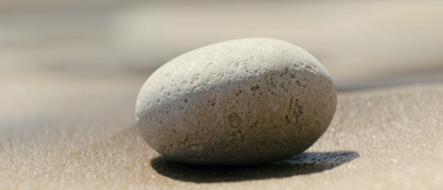 a beach stone worn smooth on every side, with no flat to set it down on
