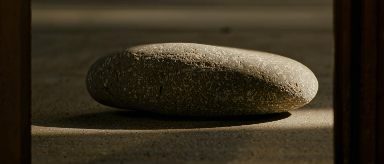 a beach stone worn smooth on every side, with no flat to set it down on