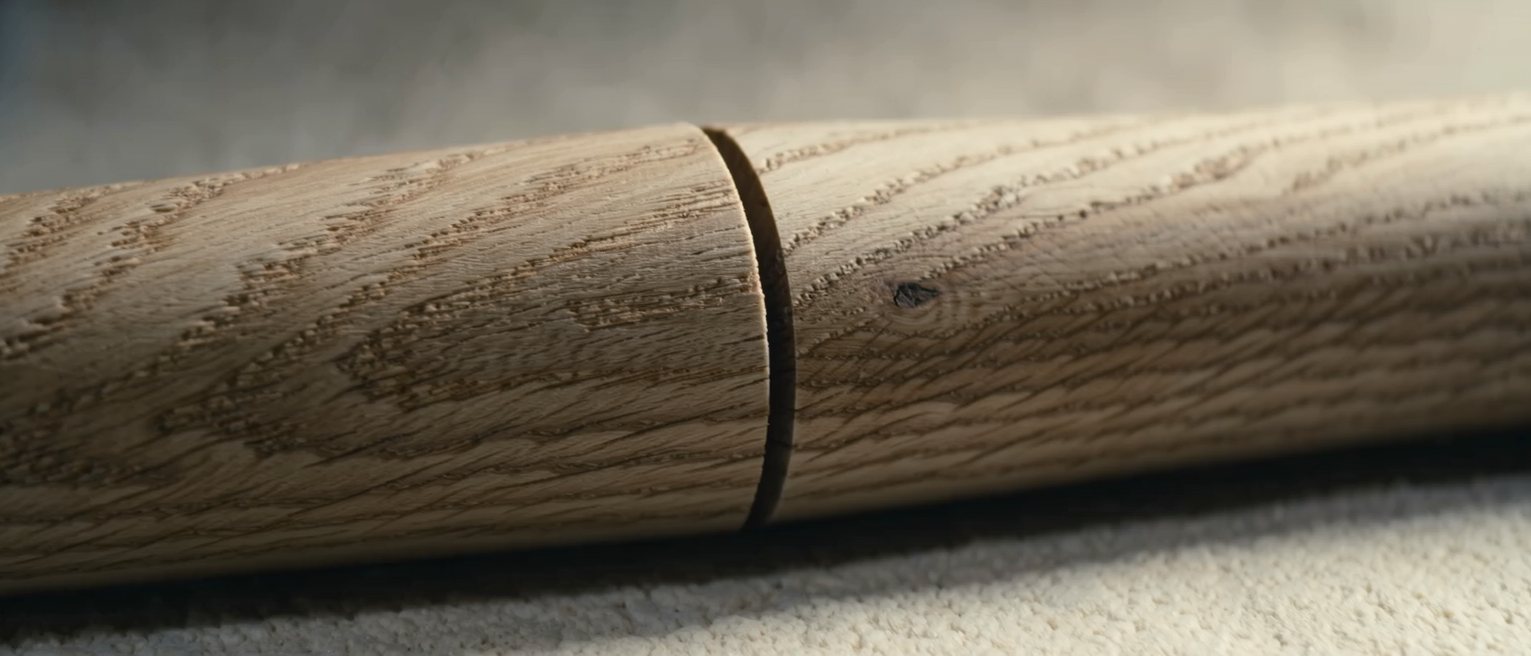 the head of an oak post with four beam tenons seated into it from four sides, the joint drawn tight with pegs