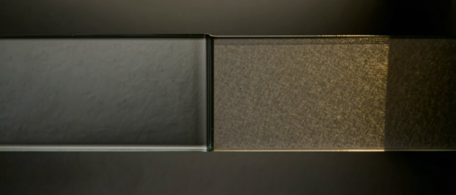 two panes of the same glass, one polished clear and the other left ground matt