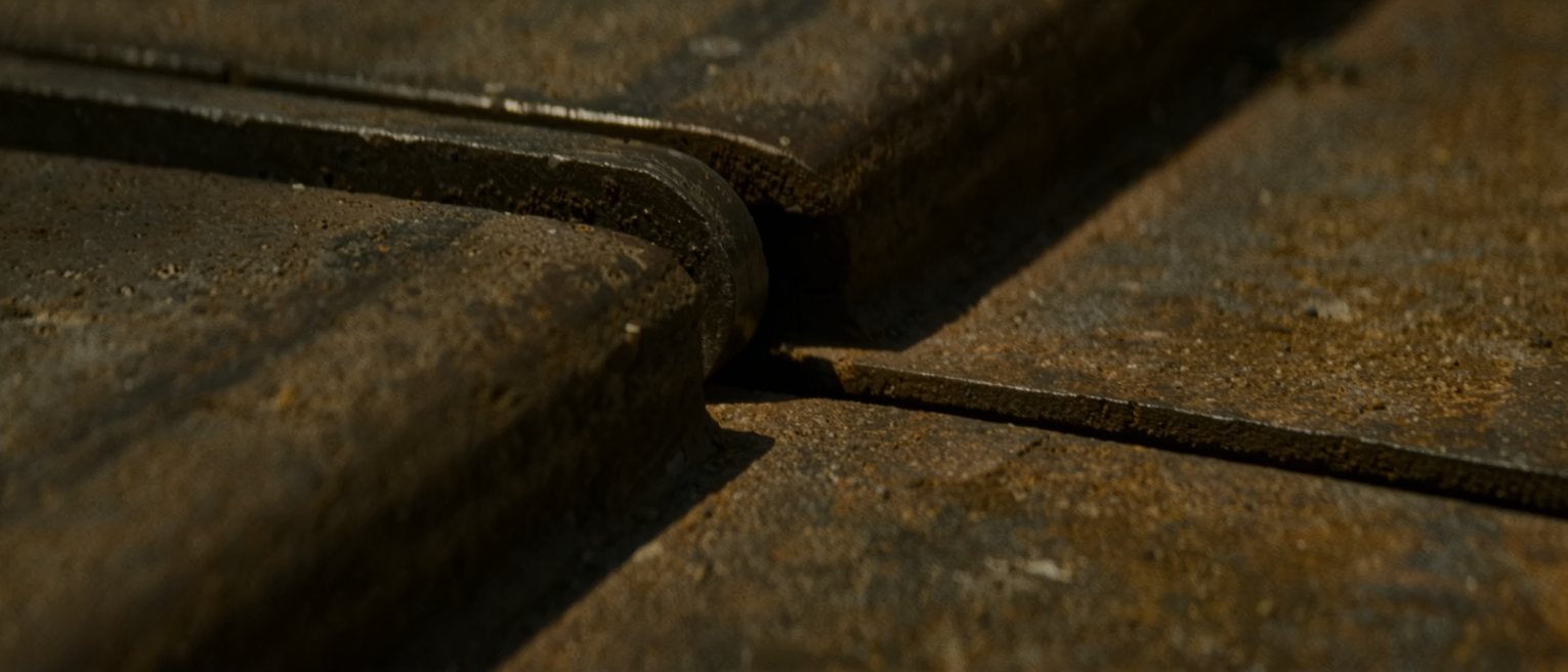 a rail expansion joint where two steel rails meet, the gap between their ends wide