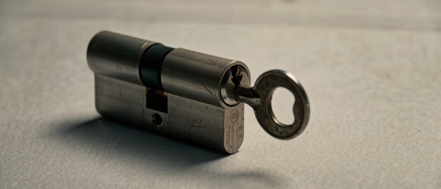 a worn lock cylinder turned open, its mechanism showing