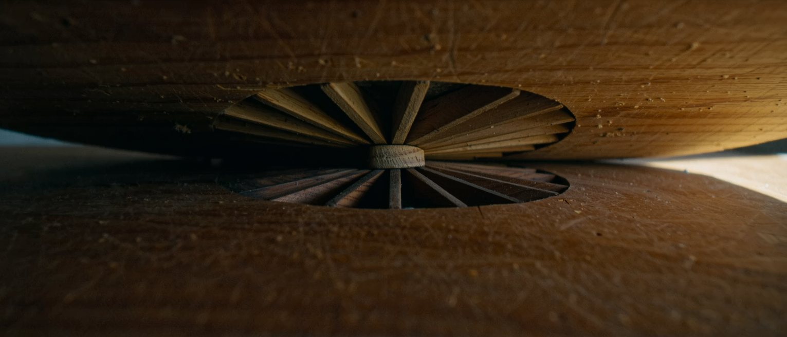 the braced underside of a wooden soundboard, the struts glued out in a fan