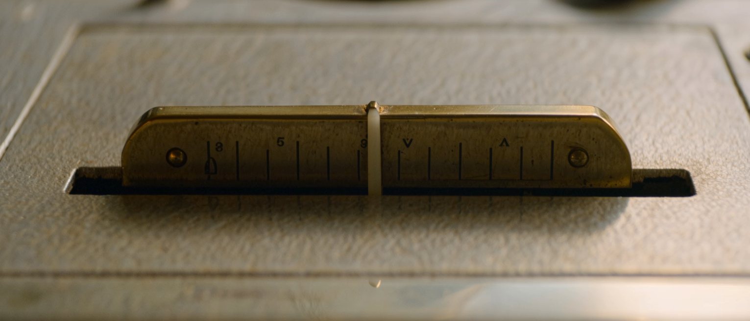 a brass lever standing midway in its slotted quadrant, seated at neither end of the slot