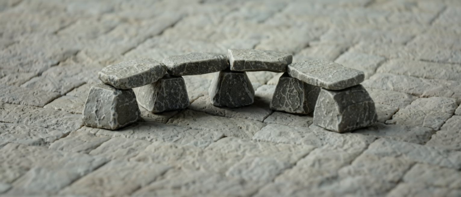 a keystone set at the crown of a stone arch, every other stone leaning on it
