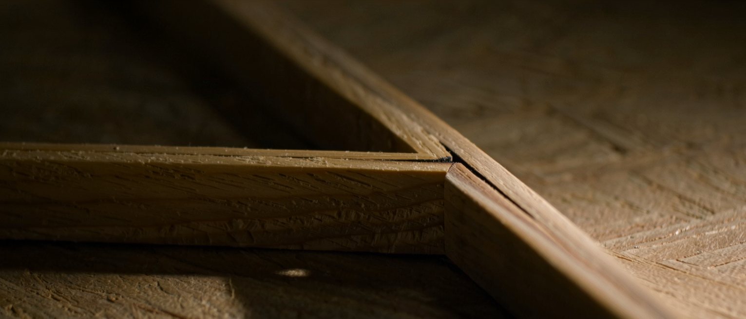 a joiner's dovetail fitted tight, the pins and tails interlocking along the whole edge
