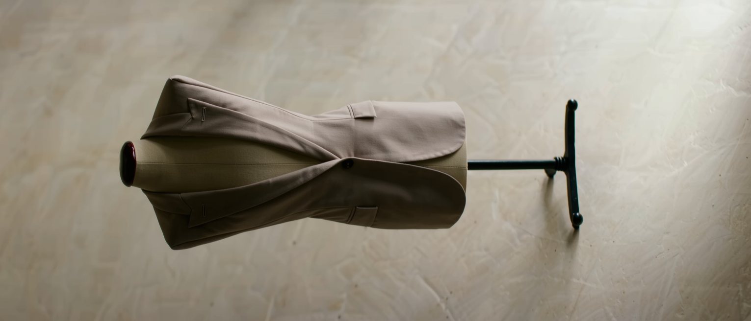 a tailored jacket on a stand, cut to a pattern made for another body