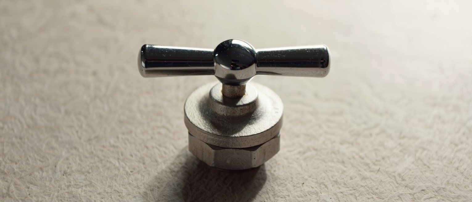a stopcock turned fully closed, the handle sitting square across the run