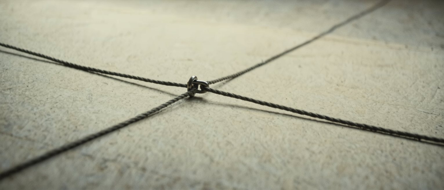 three rigging lines meeting at one shackle, each tensioned separately