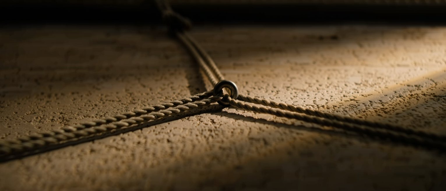 three rigging lines meeting at one shackle, each tensioned separately