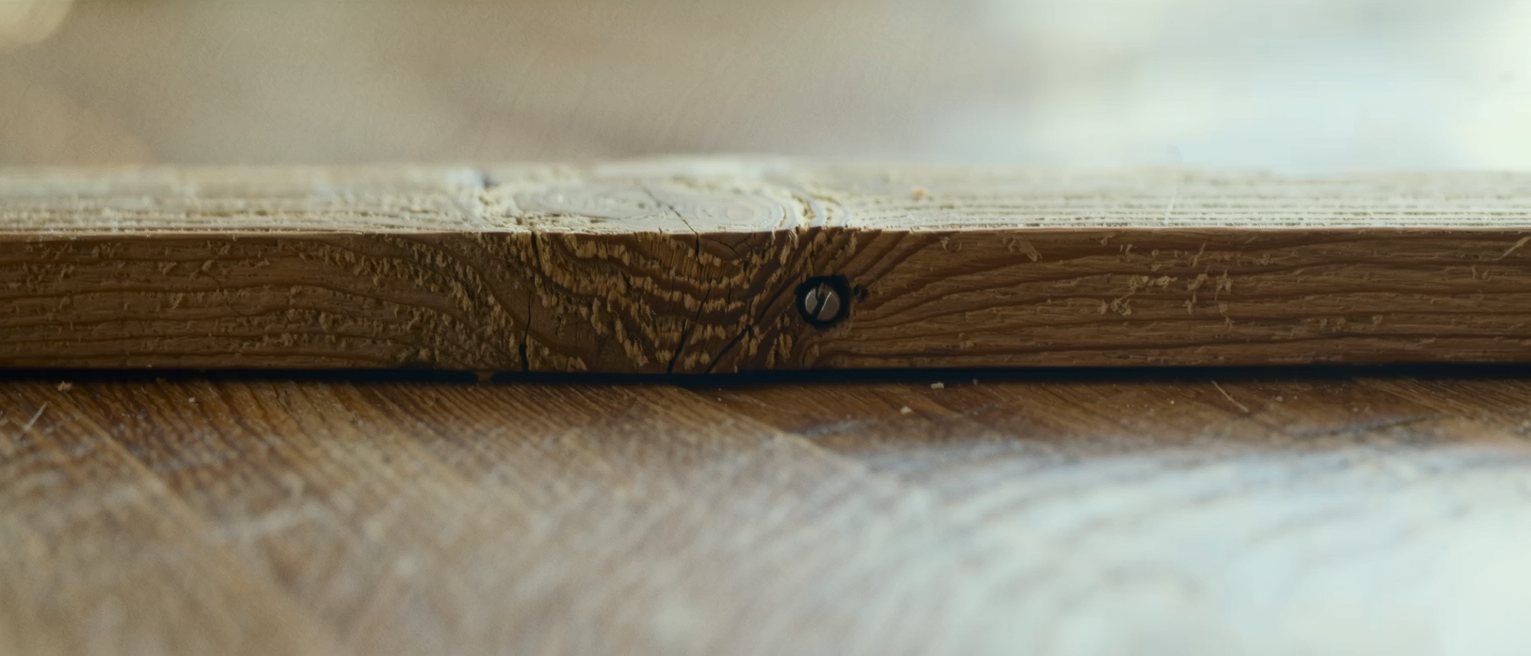 a beam with an old peg joint, the timber grown around the fixing