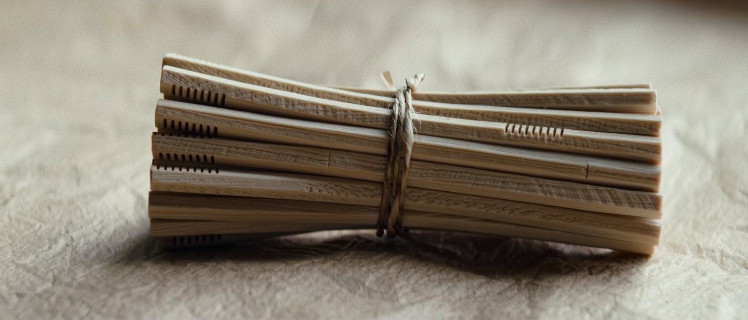 a bundle of notched tally sticks tied with cord