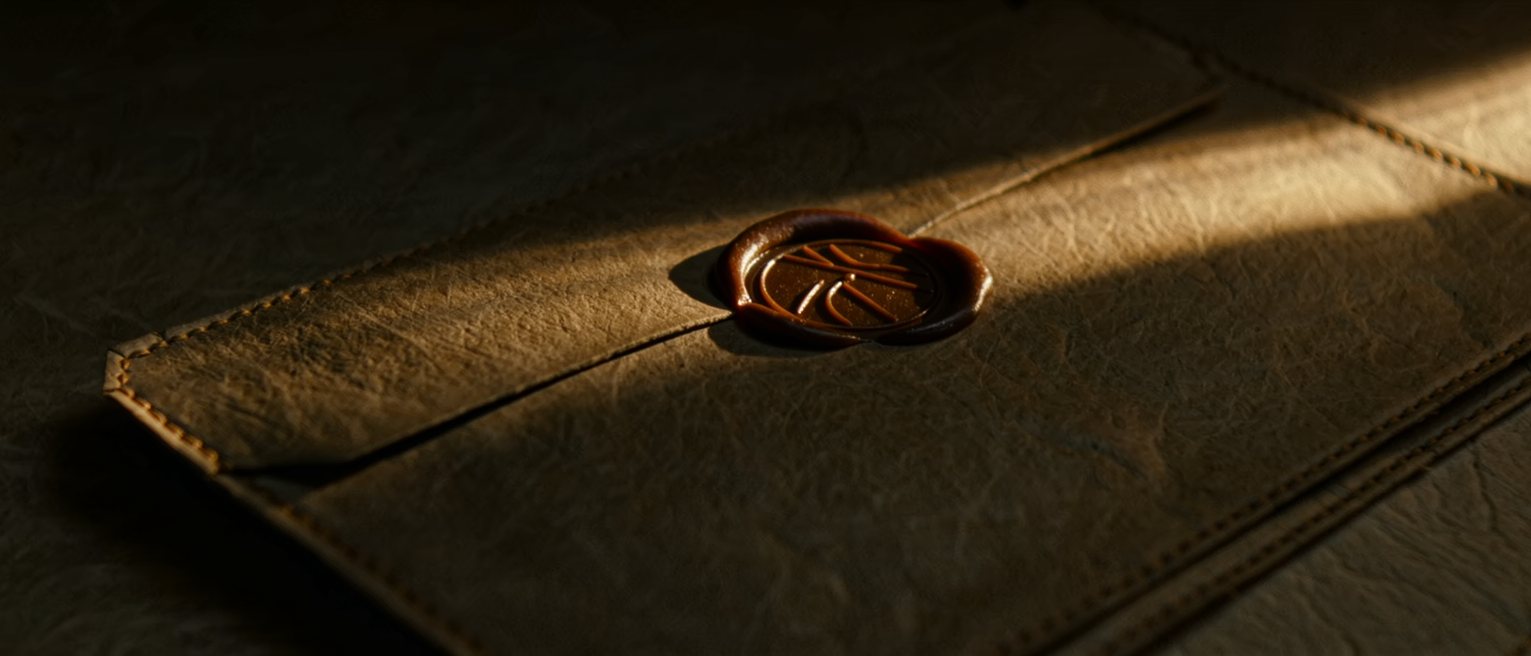 a wax seal pressed into a paper wallet, the impression clean and unbroken